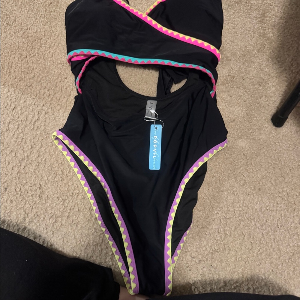 Chic Black One-Piece Swimsuit with Vibrant Trim